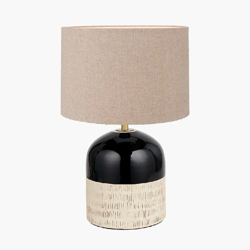 Track lighting with a brushed nickel finishLotta Black and Natural Stoneware Table Lamp with Cylinder Shade Track lighting with a brushed nickel finishLotta Black and Natural Stoneware Table Lamp with Cylinder Shade
